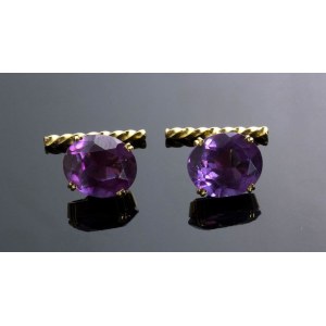 A pair of gold cufflinks