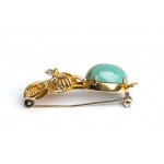 Brooch depicting a dog in gold and turquoise
