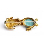 Brooch depicting a dog in gold and turquoise