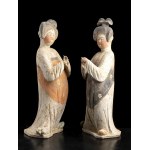 A PAIR OF PAINTED POTTERY FIGURES OF FAT LADIES