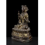 A BRONZE GUANYIN WITH TRACES OF GILDING