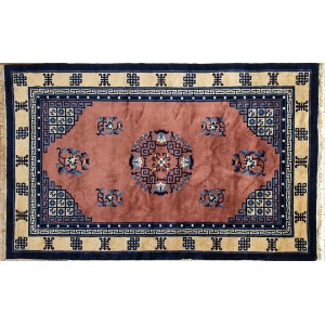 A PINK GROUND CARPET WITH A POLYCHROME DECORATION OF CHARACTERS, SYMBOLS AND STYLIZED FLORAL MOTIFS