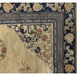 A FINE AND LARGE OCHRE GROUND CARPET WITH POLYCHROME FLORAL DECORATION
