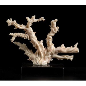 A PINK CORAL SCULPTURE WITH FIGURES