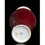 A ‘SANG DE BOEUF’ GLAZED PORCELAIN BALUSTER VASE