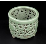 A CÉLADON GLAZED RETICULATED PORCELAIN INCENSE BURNER