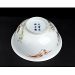 A POLYCHROME ENAMELED PORCELAIN BOWL