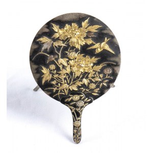 A PARTIALLY GILT METAL MIRROR-SHAPED CARD HOLDER WITH A RELIEF FLORAL DECORATION