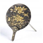 A PARTIALLY GILT METAL MIRROR-SHAPED CARD HOLDER WITH A RELIEF FLORAL DECORATION