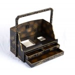A LACQUERED AND GILT WOOD TOBACCO BOX