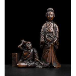 A WOOD OKIMONO WITH A SCULPTOR WORKING ON A STATUE