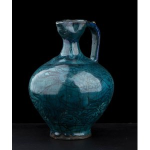 A TURQUOISE GLAZED AND PAINTED CERAMIC EWER