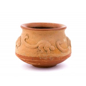A CERAMIC OLLA WITH A DECORATION OF RELIEF MONKEYS