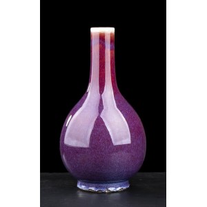 A ‘SANG DE BOEUF’ GLAZED PORCELAIN BOTTLE VASE