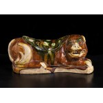 A SANCAI GLAZED CERAMIC LION SHAPED PILLOW