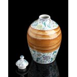 A POLYCHROME ENAMELED PORCELAIN VASE AND COVER