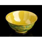 A YELLOW GROUND AND GREEN ENAMELED PORCELAIN BOWL