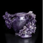 AN AMETHYST VASE AND COVER