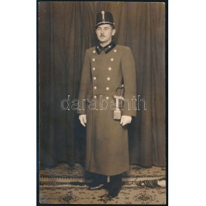 cca 1940 Horthy-korszak, katona téli köpenyben, babmérő tiszti sapkában, szablyával; fotólap ...