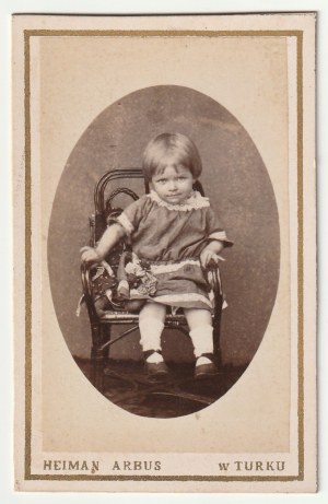TURKEY - Chaim Arbus. Portrait of a child, pasted on cardboard, dated ca. 1890; photo frontispiece, in oval, at bottom signed HEIMAN ARBUS in TURK, on verso an advertisement for a photo establishment.