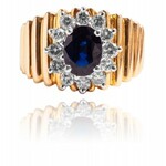 Ring with ~1.00ct sapphire and diamonds made of gold