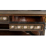 English Victorian sideboard inlaid with Sevres plates - 19th century, in ebonised wood and tuja burl, inlaid with fruit wood and purple ebony. The upper part is embellished with ceramic plaques from Sevres with bronze frames. The central drawer conceals a