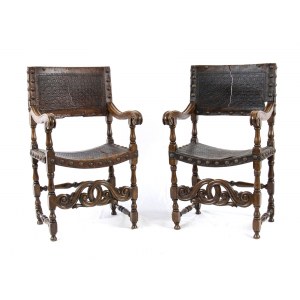 A pair of Italian armchairs - second half of the 19th century, made walnut, leather seat and back with fire-marked geometric designs. Height x width x depth: 106 x 59 x 54 cm. Item condition grading: *** fair (damaged leather both).