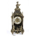 Mantel clock - France, 19th century, A shaped case resting on spinning top feet, adorned with bronze statuettes representing the 'Moire', the personification of ineluctable destiny also called Fatae, i.e. those who preside over fate, placed on the front d