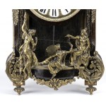 Mantel clock - France, 19th century, A shaped case resting on spinning top feet, adorned with bronze statuettes representing the 'Moire', the personification of ineluctable destiny also called Fatae, i.e. those who preside over fate, placed on the front d