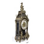 Mantel clock - France, 19th century, A shaped case resting on spinning top feet, adorned with bronze statuettes representing the 'Moire', the personification of ineluctable destiny also called Fatae, i.e. those who preside over fate, placed on the front d