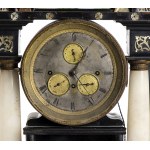 Mantel clock - Austria, Biedermeier early 19th century, temple architectural structure composed as follows: rectangular ebonised wooden base; in the middle part, flanked by two marble columns with gilded wooden plinths and capitals, a fountain with lion h