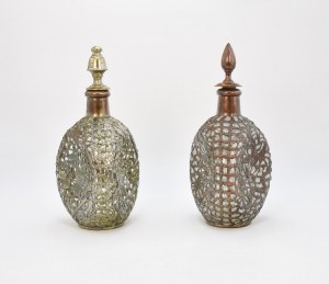 A pair of decanters in an openwork ferrule