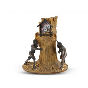 Satyr & Maenad around a tree trunk, An enamel clock in the centre of the tree trunk, Bronze