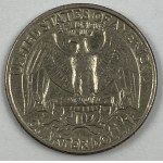 US coins: half dollar 1972 [JFK], quarter dollar 1989 [Washington], one dime 1982 [Roosevelt], five cents 1983 [Jefferson], one cent 1980 [Lincoln].
