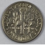 US coins: half dollar 1972 [JFK], quarter dollar 1989 [Washington], one dime 1982 [Roosevelt], five cents 1983 [Jefferson], one cent 1980 [Lincoln].