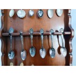 Set of collectible spoons in a wooden display case