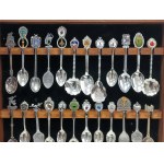 Set of 36 collectible spoons in glass case, USA