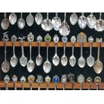 Set of 36 collectible spoons in glass case, USA