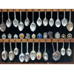 Set of 36 collectible spoons in glass case, USA