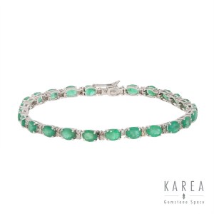So-called tennis bracelet with emeralds and diamonds, Italy, 20th century.