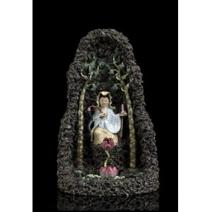 A POLYCHROME ENAMELLED PORCELAIN GROUP WITH GUANYIN IN THE GROTTO China, early 20th century
