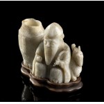 A JADE CARVING OF SHOULAO WITH A JAR China, Ming dynasty