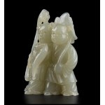 A PALE GREEN JADE CARVING OF TWO CHILDREN China, Qing dynasty, 19th century