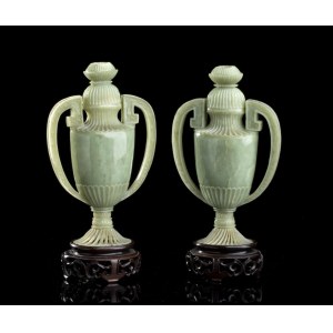 A PAIR OF PALE GREEN JADE VASES AND COVER China, early 20th century