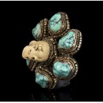 A STONE AND TURQUOISE INLAID METAL BROOCH China, 20th century