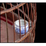 A BAMBOO BIRDCAGE WITH TWO ‘BLUE AND WHITE’ PORCELAIN BIRD FEEDERS China, 20th century