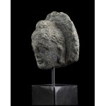 A TERRACOTTA HEAD OF A DEITY Gandhara style