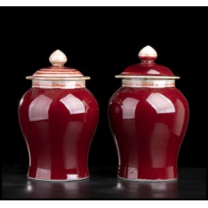 A PAIR OF ‘SANG DE BOEUF’ GLAZED JARS AND COVER China, 20th century