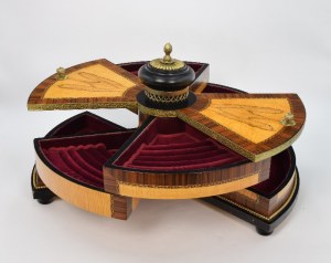 Revolving jewelry box with eight storage compartments on a circle cutout