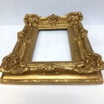 Richly decorated, gilded frame
